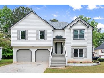 Charming two-story home featuring a two-car garage, well-maintained lawn, and inviting front entrance at 4258 Anderson Ridge Way, Austell, GA 30106