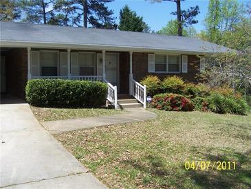 Charming brick home with a well-maintained front yard and inviting entrance at 1170 Blair Bridge Rd, Austell, GA 30168
