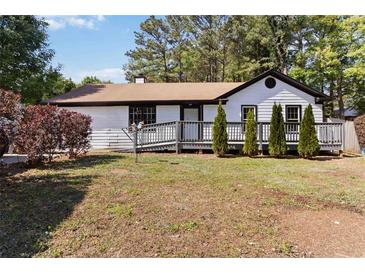 Charming single-story home with a well-maintained lawn, cozy front porch, and fresh exterior paint at 4264 Windward Ln, Norcross, GA 30093