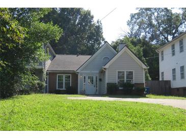 Charming home with a manicured lawn and mature trees at 490 Culberson Sw St, Atlanta, GA 30310