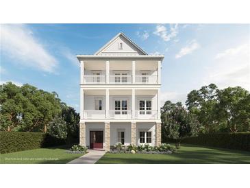 Charming three-story home featuring double balconies and a welcoming entrance at 1417 Coretta Scott Bnd, Atlanta, GA 30318