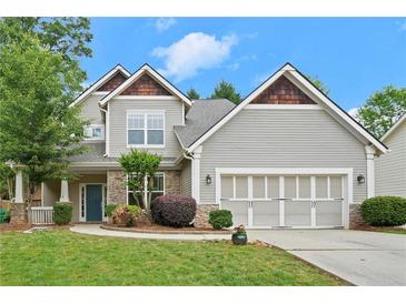 Charming two-story home with stone accents, manicured landscaping, and an attached two-car garage at 2995 Boulder Walk Se Ct, Atlanta, GA 30316