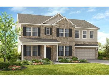 Charming two-story home with a manicured lawn, gray brick, a covered entry, and a two-car garage at 5240 Trescott Path, Cumming, GA 30028