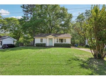 Charming single-story home featuring a well-maintained lawn and traditional facade at 176 Nancy Se Dr, Marietta, GA 30067
