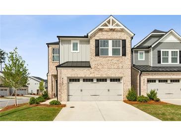 Charming two-story home with a neutral brick facade, a two-car garage, and a well-manicured front lawn at 4389 Treadle Sw Rd, Mableton, GA 30126