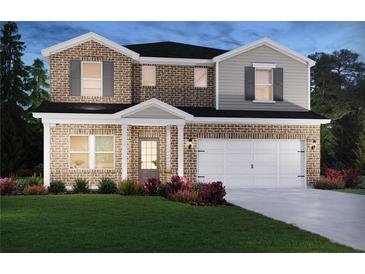 Inviting two-story home with brick facade, lush lawn, and attached two-car garage at 361 Tallulah Ln, Grayson, GA 30017