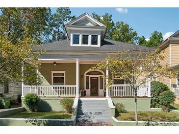 Charming craftsman-style home featuring a covered front porch and a landscaped yard at 501 Dargan Sw Pl, Atlanta, GA 30310