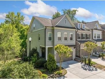 Charming two-story home with manicured landscaping and a spacious two-car garage, offering both curb appeal and convenience at 2166 Sonoma Se Dr, Smyrna, GA 30080