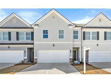 Charming townhome showcases craftsman architecture and a two-car garage at 6372 Rosetta Sw Dr, Atlanta, GA 30331