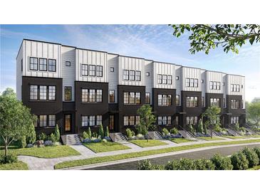 Modern townhome exterior featuring black brick, white siding, large windows, and manicured landscaping at 435 Mezzo Ln # 86, Alpharetta, GA 30009