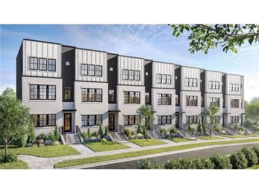 Charming townhomes featuring modern design, beautiful landscaping, and inviting curb appeal at 439 Mezzo Ln # 88, Alpharetta, GA 30009