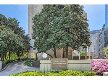 Beautiful apartment building exterior with manicured landscaping and an elegant entrance at 147 15Th Ne St # 16C, Atlanta, GA 30309