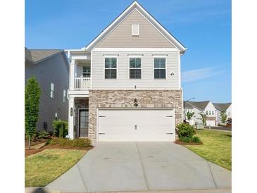 Charming two-story home featuring a brick facade and a two-car garage at 3747 Silvery Way, Powder Springs, GA 30127