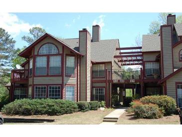 Attractive multi-level condos with green landscaping, balconies, and architectural design at 412 Hawkstone Way, Alpharetta, GA 30022