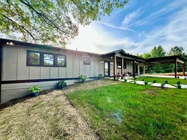 Charming single-story home with a lush green lawn and inviting carport at 4901 Prince Se Rd, Smyrna, GA 30082