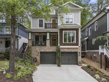 Charming two-story home with a brick foundation, dual garages, and a well-manicured front yard at 3253 Cates Ne Ave, Brookhaven, GA 30319