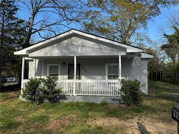 Charming single-story home with a welcoming front porch and fresh gray exterior paint at 753 2Nd St, Stone Mountain, GA 30083