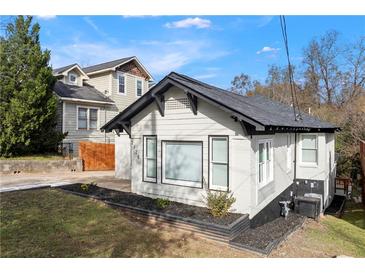 Charming home with a modern paint scheme, manicured landscaping, and inviting curb appeal at 2128 Hosea L Williams Ne Dr, Atlanta, GA 30317