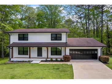 Charming two-story home with a freshly painted exterior and a well-maintained front yard at 3717 Birchbriar Ct, Decatur, GA 30034