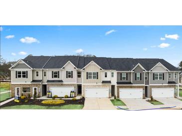 Charming new townhomes with stone accents, garages, and manicured landscaping for appealing curb appeal at 349 Elgin Dr, Lawrenceville, GA 30045