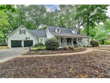 Charming two-story home with a brick walkway and well-maintained landscaping at 2130 Monticello Pl, Lawrenceville, GA 30043