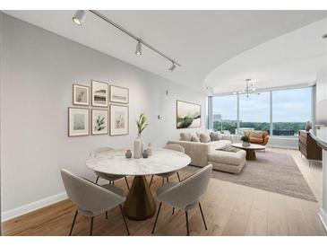 Bright living and dining room featuring a neutral palette, floor-to-ceiling windows, and stylish decor at 3338 Peachtree Rd # 1210, Atlanta, GA 30326