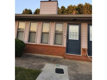 Charming condo with a brick facade and meticulously maintained landscaping at 4173 Stillwater Dr, Duluth, GA 30096