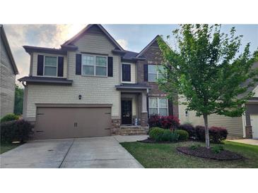 Charming two-story home with landscaped yard, two-car garage, and a welcoming front porch at 118 Reunion Pl, Acworth, GA 30102