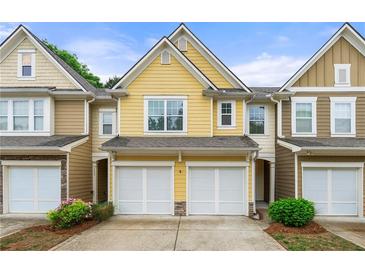 Charming townhome with a two-car garage and well maintained landscaping at 2060 Ellison Nw Way # 11, Kennesaw, GA 30152