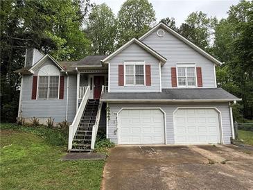 Charming two-story home features a two car garage and gray siding at 2326 Westland Way, Acworth, GA 30102
