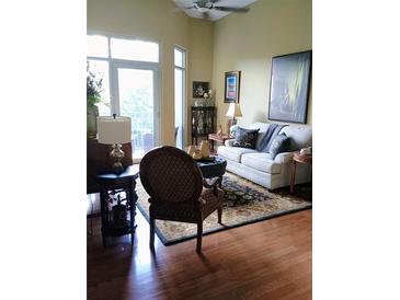 Cozy living room features plush seating, a decorative rug, and a ceiling fan for added comfort at 711 Cosmopolitan Ne Dr # 123, Atlanta, GA 30324
