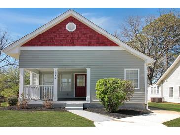 Charming bungalow-style home with red accents and a welcoming front porch at 3087 Semmes St, Atlanta, GA 30344