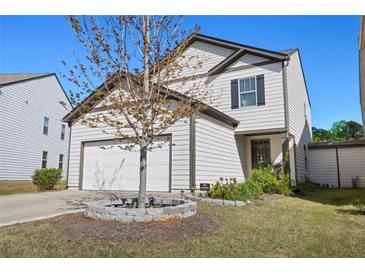 Charming two-story home featuring a two-car garage and a well-manicured lawn at 111 Centennial Ridge Dr, Acworth, GA 30102