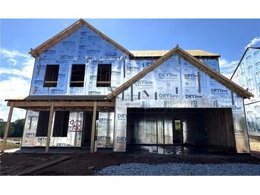 Exterior view of home under construction with visible framing and weather-resistant barriers at 72 Warrior Ct, Braselton, GA 30548