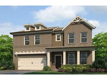 Charming two-story brick home with covered porch and attached garage, surrounded by lush landscaping at 219 Whispering Pines Ave, Conyers, GA 30094