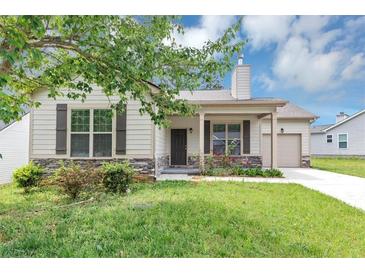 Charming single-story home with neutral siding, stone accents, and a well-maintained lawn at 6755 Biscayne Blvd, Rex, GA 30273