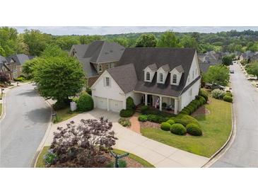Charming home with a manicured lawn, mature trees, and a two-car garage, creating inviting curb appeal at 1021 Bluffhaven Ne Way, Atlanta, GA 30319