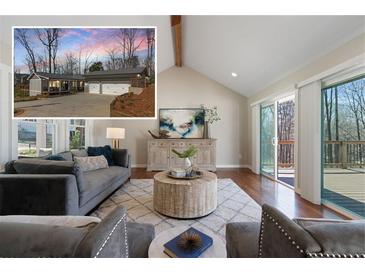 Inviting living room with vaulted ceilings and sliding doors to deck. Exterior view inset included at 6265 Reives Rd, Cumming, GA 30041
