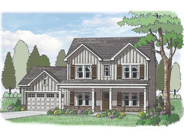 Charming two-story home with a welcoming front porch and traditional design elements at 1276 Cherry Bark Ct, Loganville, GA 30052