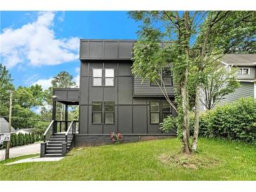 Modern two-story home featuring sleek lines and ample windows for natural light at 3139 Alston Dr, Decatur, GA 30032