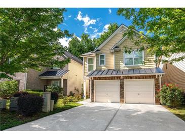 Charming two-story home with a two-car garage and well-maintained landscaping at 2034 Reavis Blf, Conyers, GA 30012