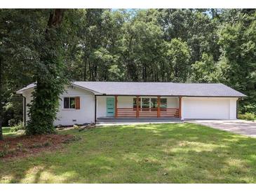 Charming single story home with a front yard and a garage at 3918 Artist Vw, Decatur, GA 30034