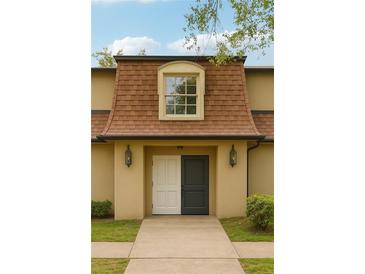 Charming home featuring unique double doors, sconce lighting, and a classic window accent at 2930 Parc Lorraine, Lithonia, GA 30038