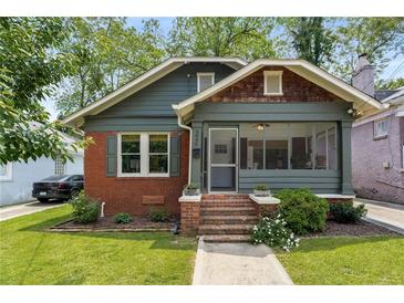 Charming two-story home with a blend of brick and siding, a manicured lawn, and inviting curb appeal at 509 Rankin Ne St, Atlanta, GA 30308