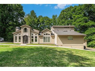 Stunning home with a manicured lawn and stately curb appeal at 387 Nickajack Se Rd, Mableton, GA 30126