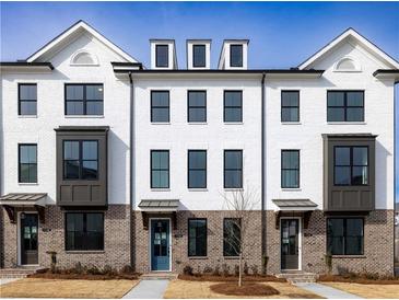 Beautiful townhomes feature a brick facade and modern architectural details at 4253 Millcroft Pl # 198, Buford, GA 30518