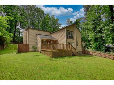Spacious backyard with a wooden deck perfect for entertaining and outdoor enjoyment at 2926 Swarthmore Dr, Lawrenceville, GA 30044