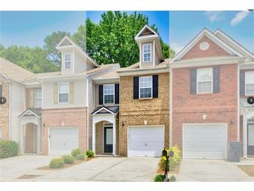 Charming townhome with brick facade, one-car garage, and well-maintained landscaping at 2457 Birkhall Way, Lawrenceville, GA 30043