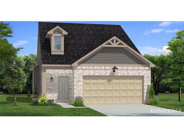 Charming two-story home with light brick, complemented by a two-car garage and a well-maintained lawn at 288 Abbotts Crossing Cir, Conyers, GA 30094