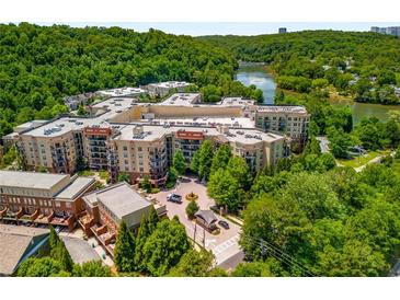 Stunning aerial view of a lakeside community with lush green trees and beautiful architecture at 200 River Vista Dr # 540, Atlanta, GA 30339